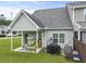 A well-maintained backyard features a covered patio, grill, and green lawn at 192 Buchanan Cir, Goose Creek, SC 29445