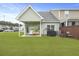 A well-maintained backyard features a covered patio, grill, and green lawn at 192 Buchanan Cir, Goose Creek, SC 29445