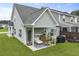 A well-maintained backyard features a covered patio, grill, and green lawn at 192 Buchanan Cir, Goose Creek, SC 29445
