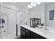 Bright bathroom featuring a double sink vanity with a glass-enclosed shower at 192 Buchanan Cir, Goose Creek, SC 29445