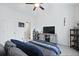 A calming bedroom featuring neutral colors, a TV, and a view to the ensuite bathroom at 192 Buchanan Cir, Goose Creek, SC 29445