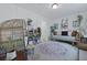 Serene bonus room with a cozy sofa and plants for relaxing at 192 Buchanan Cir, Goose Creek, SC 29445