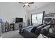 Cozy bedroom featuring vaulted ceilings, a ceiling fan, and a flatscreen TV on a barn door entertainment center at 192 Buchanan Cir, Goose Creek, SC 29445