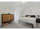 Light-filled bedroom with a vaulted ceiling and a wooden dresser at 192 Buchanan Cir, Goose Creek, SC 29445