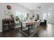Cozy dining area featuring hardwood floors, chandelier, and a window with plants at 192 Buchanan Cir, Goose Creek, SC 29445