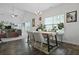 Bright dining area with wood floors, a chandelier, and a view of the adjacent living area at 192 Buchanan Cir, Goose Creek, SC 29445