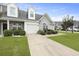 Inviting townhome with fresh green lawn and manicured bushes around the front at 192 Buchanan Cir, Goose Creek, SC 29445