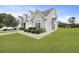 Well-maintained townhome featuring a lush green lawn and a neatly paved walkway at 192 Buchanan Cir, Goose Creek, SC 29445