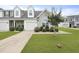 Charming townhome with a one-car garage, manicured lawn, and fresh landscaping at 192 Buchanan Cir, Goose Creek, SC 29445