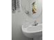 Half bathroom featuring a white vanity and a round mirror at 192 Buchanan Cir, Goose Creek, SC 29445