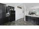 Modern kitchen boasts granite counters, dark cabinets, and stainless appliances at 192 Buchanan Cir, Goose Creek, SC 29445