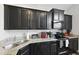 Stylish kitchen with dark cabinetry, granite countertops, and a stainless steel dishwasher at 192 Buchanan Cir, Goose Creek, SC 29445