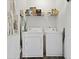 Laundry room featuring a washer, dryer, and shelf with laundry supplies at 192 Buchanan Cir, Goose Creek, SC 29445