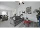 Spacious living room featuring a gray sofa, a red coffee table, and access to dining area at 192 Buchanan Cir, Goose Creek, SC 29445