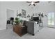 Comfortable living room with a gray sofa, plants, and natural light at 192 Buchanan Cir, Goose Creek, SC 29445