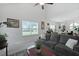 Airy living room with a gray sofa, a red coffee table, and plenty of natural light at 192 Buchanan Cir, Goose Creek, SC 29445