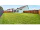 Expansive backyard featuring lush green grass and a sturdy wooden fence at 1973 Parish House Cir, Johns Island, SC 29455