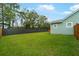 Expansive backyard with lush green grass and tall trees, perfect for outdoor activities at 1973 Parish House Cir, Johns Island, SC 29455