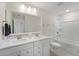 Bright bathroom featuring double sinks, modern fixtures, and a clean, white aesthetic at 1973 Parish House Cir, Johns Island, SC 29455