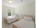 Bright bedroom with twin beds, soft lighting, and a soothing color palette at 1973 Parish House Cir, Johns Island, SC 29455