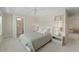 Bright bedroom with a ceiling fan and ensuite bath, features a soothing color palette and ample natural light at 1973 Parish House Cir, Johns Island, SC 29455