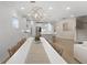 Spacious dining room area with modern lighting and an open layout into the kitchen and living room at 1973 Parish House Cir, Johns Island, SC 29455