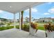 Inviting covered front porch with white columns and view of a well-maintained neighborhood at 1973 Parish House Cir, Johns Island, SC 29455