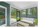 Cozy screened porch featuring comfortable seating and views of the fenced backyard at 1973 Parish House Cir, Johns Island, SC 29455