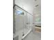 Luxury shower with glass door, marble tile, built-in bench, and modern fixtures at 1973 Parish House Cir, Johns Island, SC 29455