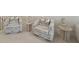 Comfortable sitting area with patterned swivel chairs, side tables, and soft lighting at 1973 Parish House Cir, Johns Island, SC 29455
