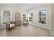 Bright sitting room with natural light, wooden floors, stylish chairs, and neutral decor at 1973 Parish House Cir, Johns Island, SC 29455