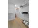 Spacious walk-in closet with white wire shelving and hardwood flooring, ideal for organization at 1973 Parish House Cir, Johns Island, SC 29455