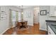 Cozy dining area features a round table with seating for four and lots of natural light at 1975 Fruitwood Ave, Charleston, SC 29414