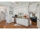 Eat-in kitchen with stainless steel appliances, granite countertops, and hardwood floors at 1975 Fruitwood Ave, Charleston, SC 29414