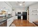 Modern kitchen features stainless steel appliances, granite countertops, and white cabinetry at 1975 Fruitwood Ave, Charleston, SC 29414