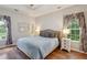 Comfortable bedroom with hardwood floors, tray ceiling, and soft neutral colors at 1975 Fruitwood Ave, Charleston, SC 29414