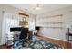 Spacious home office featuring built-in shelves, a ceiling fan, and natural light at 1975 Fruitwood Ave, Charleston, SC 29414