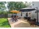 Outdoor patio featuring an umbrella and seating area, perfect for relaxing or entertaining at 1975 Fruitwood Ave, Charleston, SC 29414