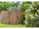 Back gate in backyard leading to walking trail and green space at 201 Old Market Ct, Moncks Corner, SC 29461