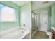 Bathroom with a soaking tub, glass shower, and tile floors at 201 Old Market Ct, Moncks Corner, SC 29461