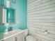 Stylish bathroom with a modern vanity, updated fixtures, and decorative shiplap accent wall at 201 Old Market Ct, Moncks Corner, SC 29461
