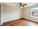 Bedroom featuring hardwood floors, a ceiling fan, and a large window at 201 Old Market Ct, Moncks Corner, SC 29461