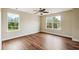 Large bedroom with hardwood floors, ceiling fan, and plenty of natural light at 201 Old Market Ct, Moncks Corner, SC 29461