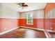 A bright bedroom with a painted accent wall and wood laminate flooring at 201 Old Market Ct, Moncks Corner, SC 29461