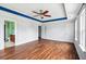 Spacious bedroom with hardwood floors, crown molding, and ample natural light at 201 Old Market Ct, Moncks Corner, SC 29461