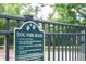 Dog park rules posted on sign adjacent to the neighborhood park at 201 Old Market Ct, Moncks Corner, SC 29461