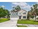 Inviting two-story home with manicured lawn, two-car garage and beautiful landscaping at 201 Old Market Ct, Moncks Corner, SC 29461