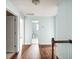 Hallway with beautiful hardwood floors and view of a bathroom with tile floors at 201 Old Market Ct, Moncks Corner, SC 29461