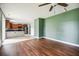 Living room leading to kitchen area with hardwood floors, and plenty of natural light at 201 Old Market Ct, Moncks Corner, SC 29461