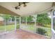 Spacious screened porch overlooking a fenced backyard and lush greenery and mature trees at 201 Old Market Ct, Moncks Corner, SC 29461